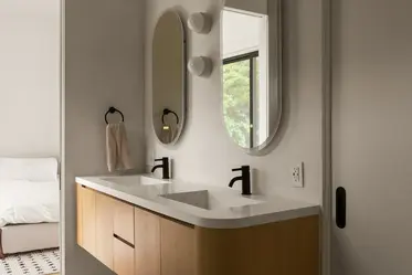 Floating wood double vanity with wall-mounted mirrors